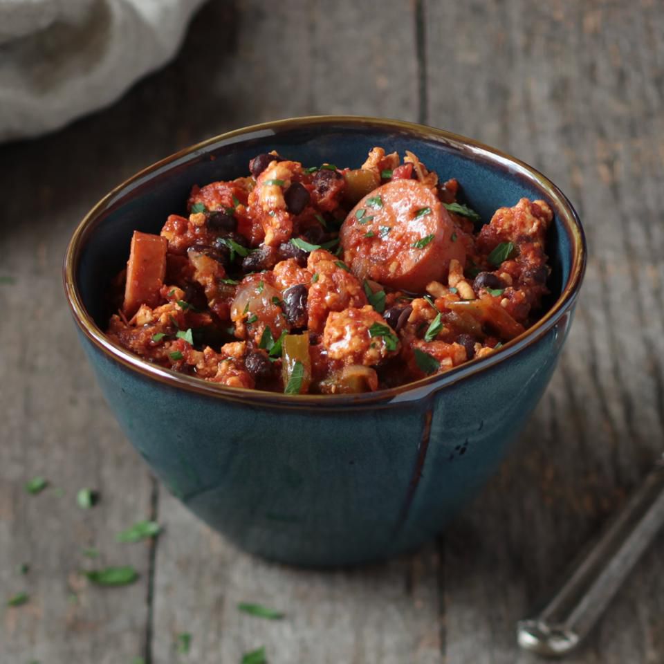 A small meal of slow-cooked cajun chili simmering with beans and spices.